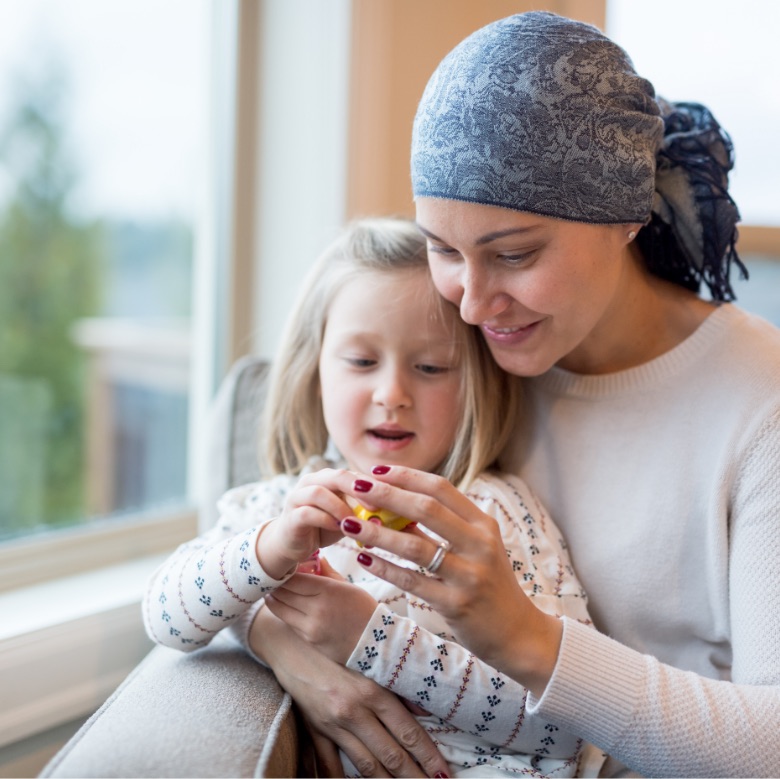 young Canadian mother and daughter enjoying sitting time together as she deals with her illness